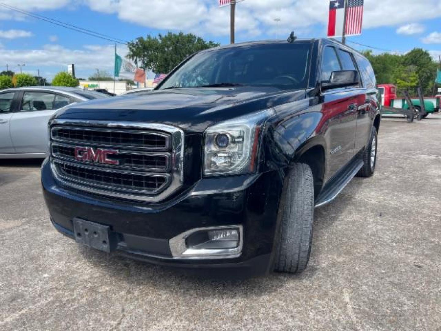 2016 Onyx Black GMC Yukon XL SLE (1GKS1FKC6GR) with an EcoTec3 5.3L V-8 gasoline direct injection engine, located at 7935 Gulf Freeway, Houston, 77017, (832) 266-1645, 29.684393, -95.275665 - Photo#2