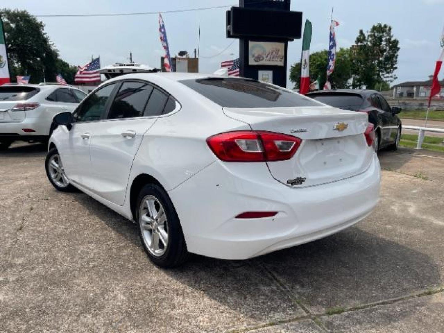 2018 Summit White Chevrolet Cruze LT Auto (1G1BE5SM0J7) with an 1.4L I-4 gasoline direct injection engine, located at 7935 Gulf Freeway, Houston, 77017, (832) 266-1645, 29.684393, -95.275665 - Photo#4