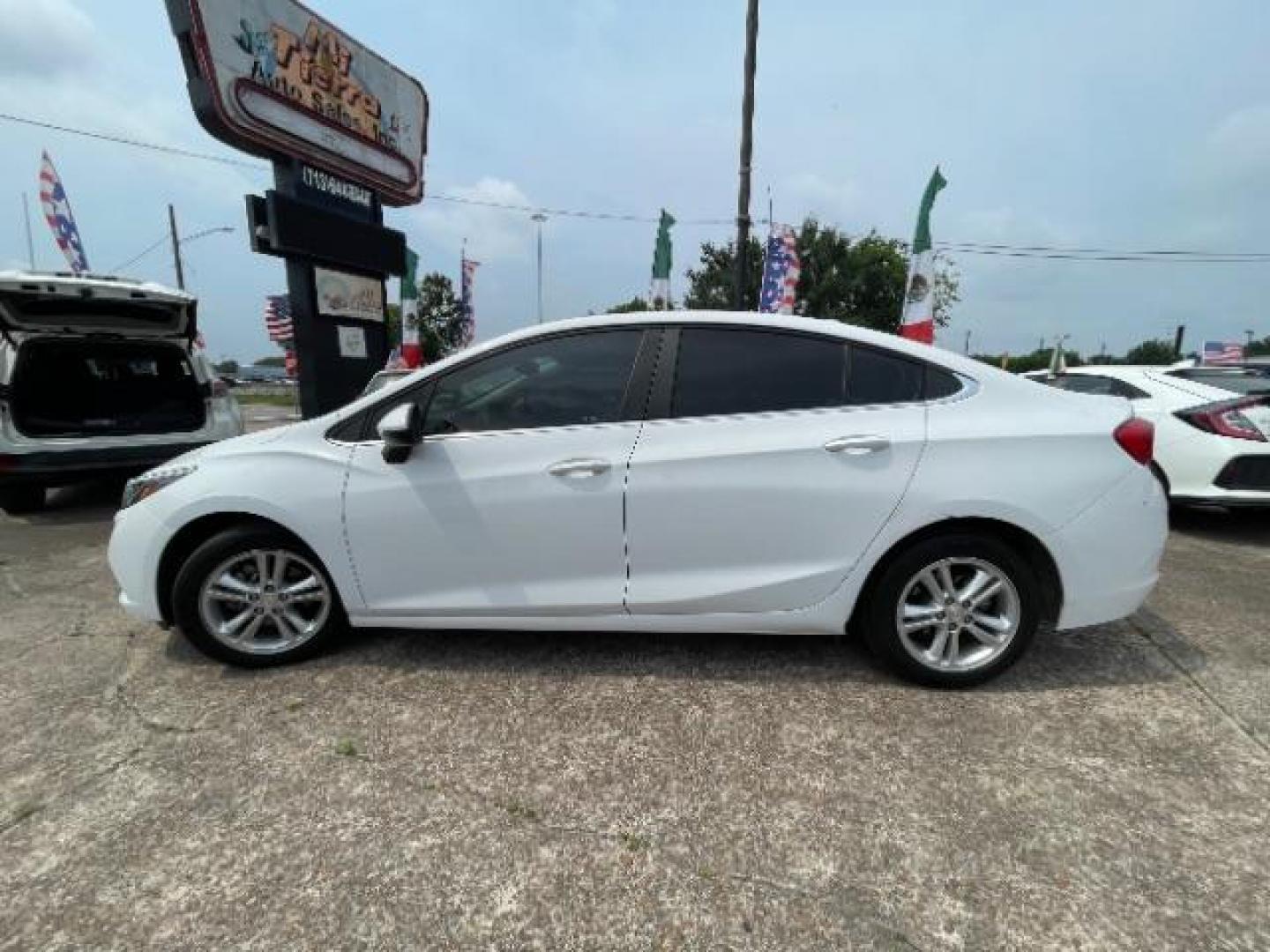 2018 Summit White Chevrolet Cruze LT Auto (1G1BE5SM0J7) with an 1.4L I-4 gasoline direct injection engine, located at 7935 Gulf Freeway, Houston, 77017, (832) 266-1645, 29.684393, -95.275665 - Photo#18
