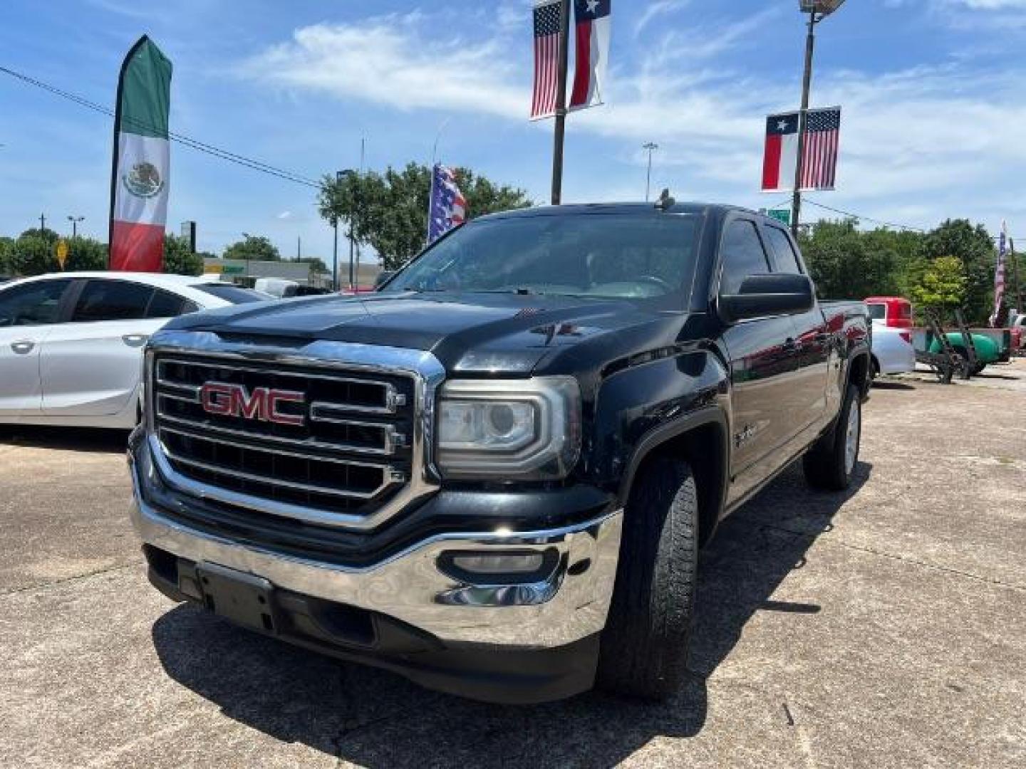 2016 Onyx Black GMC Sierra 1500 SLE (1GTR1MEC0GZ) with an EcoTec3 4.3L V-6 gasoline direct injection engine, located at 7935 Gulf Freeway, Houston, 77017, (832) 266-1645, 29.684393, -95.275665 - Photo#2