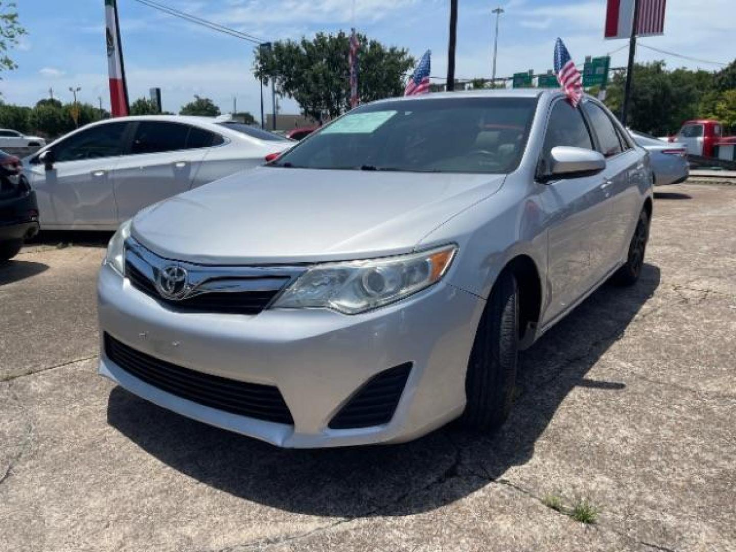2014 Classic Silver Metallic Toyota Camry LE (4T4BF1FK8ER) with an 2.5L I-4 DOHC engine, located at 7935 Gulf Freeway, Houston, 77017, (832) 266-1645, 29.684393, -95.275665 - Photo#2