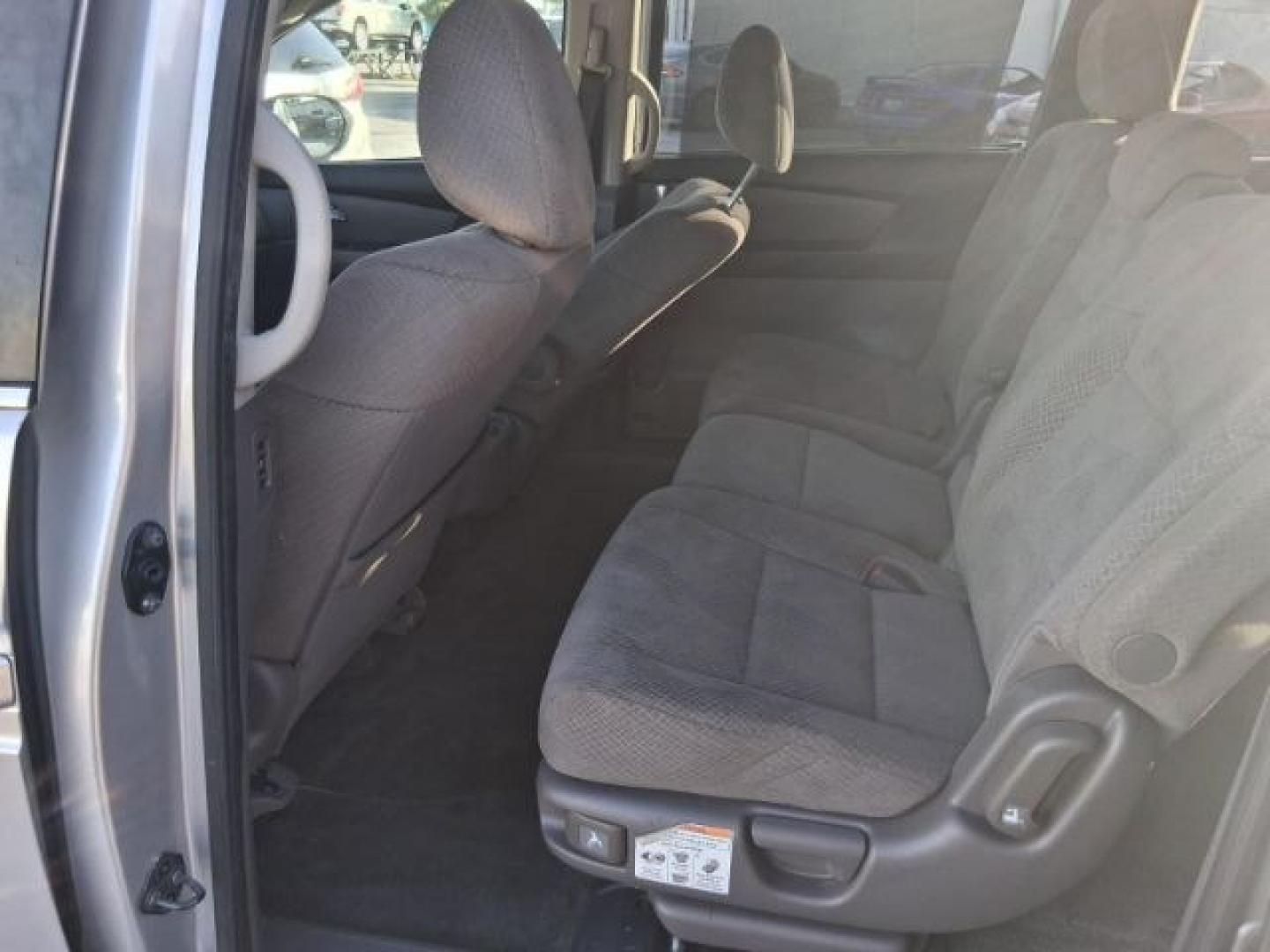 2015 Alabaster Silver Met /Gray Honda Odyssey EX (5FNRL5H49FB) with an 3.5L V-6 i-VTEC vari engine, Automatic transmission, located at 4545 Spencer Hwy., Pasadena, 77504, (832) 266-1645, 29.666037, -95.173775- Photo#4