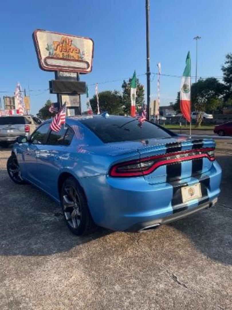 2015 Jazz Blue Pearlcoat /Black Dodge Charger SXT (2C3CDXHG5FH) with an 3.6L V-6 DOHC engine, located at 7935 Gulf Freeway, Houston, 77017, (832) 266-1645, 29.684393, -95.275665 - Photo#3