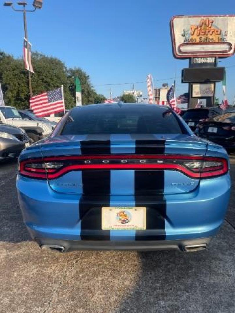 2015 Jazz Blue Pearlcoat /Black Dodge Charger SXT (2C3CDXHG5FH) with an 3.6L V-6 DOHC engine, located at 7935 Gulf Freeway, Houston, 77017, (832) 266-1645, 29.684393, -95.275665 - Photo#4
