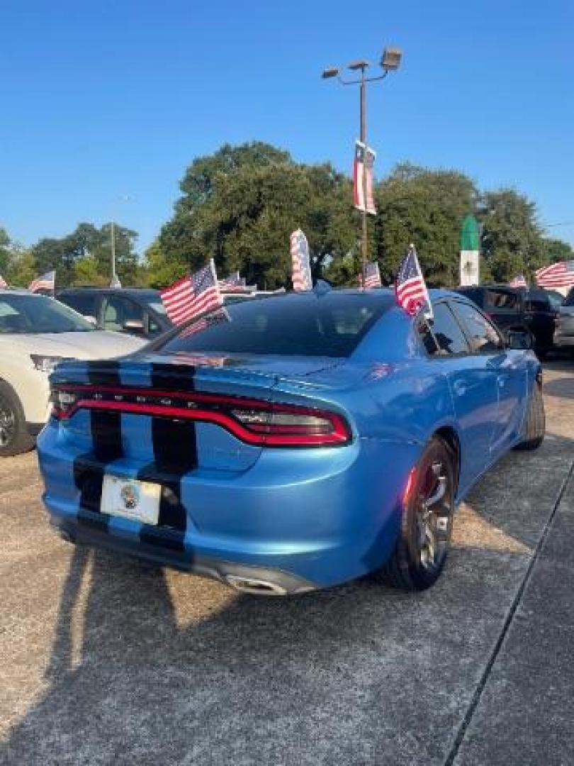 2015 Jazz Blue Pearlcoat /Black Dodge Charger SXT (2C3CDXHG5FH) with an 3.6L V-6 DOHC engine, located at 7935 Gulf Freeway, Houston, 77017, (832) 266-1645, 29.684393, -95.275665 - Photo#5