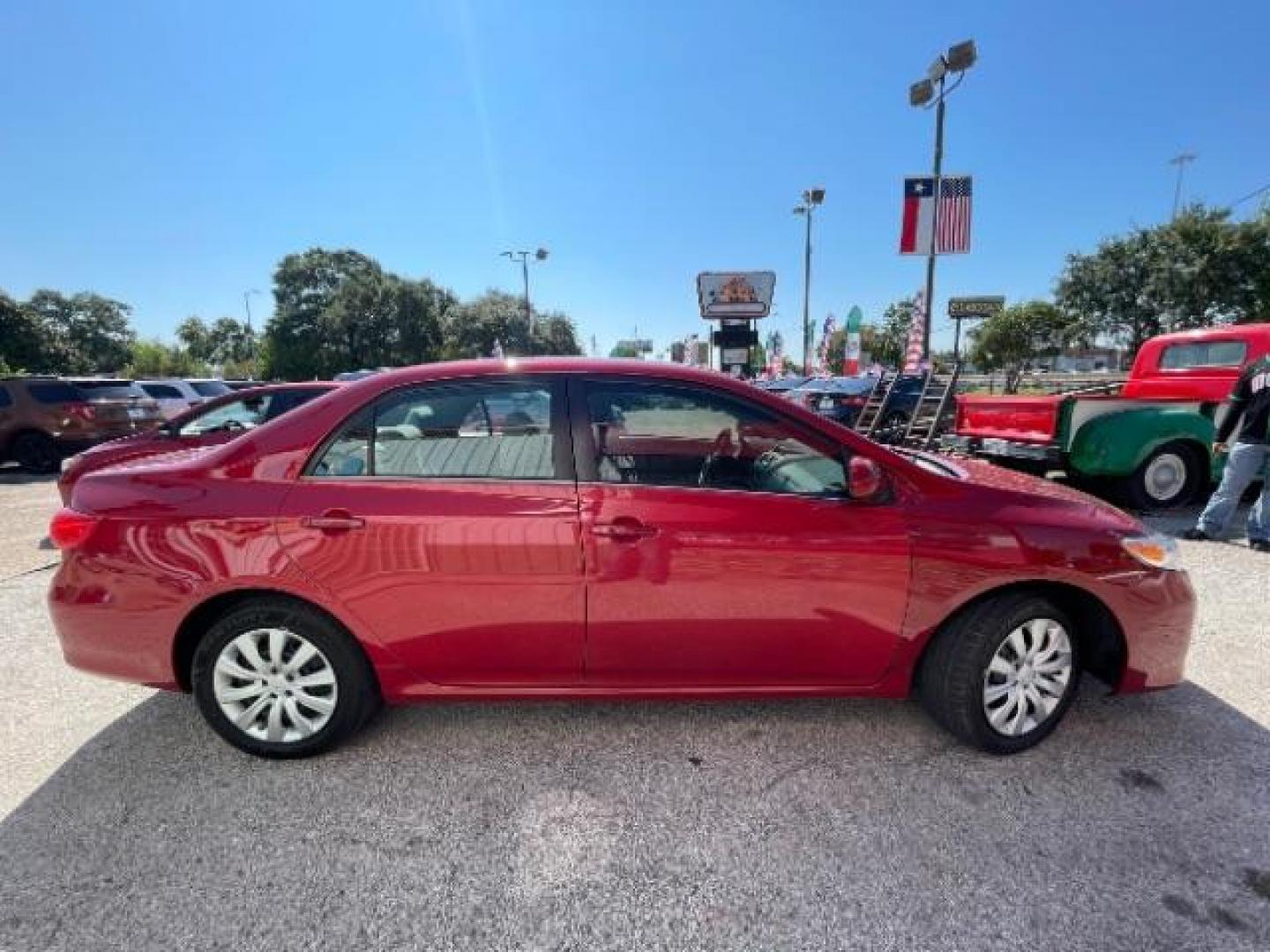 2013 Barcelona Red Metallic Toyota Corolla LE (2T1BU4EE6DC) with an 1.8L I-4 DOHC engine, located at 7935 Gulf Freeway, Houston, 77017, (832) 266-1645, 29.684393, -95.275665 - Photo#7