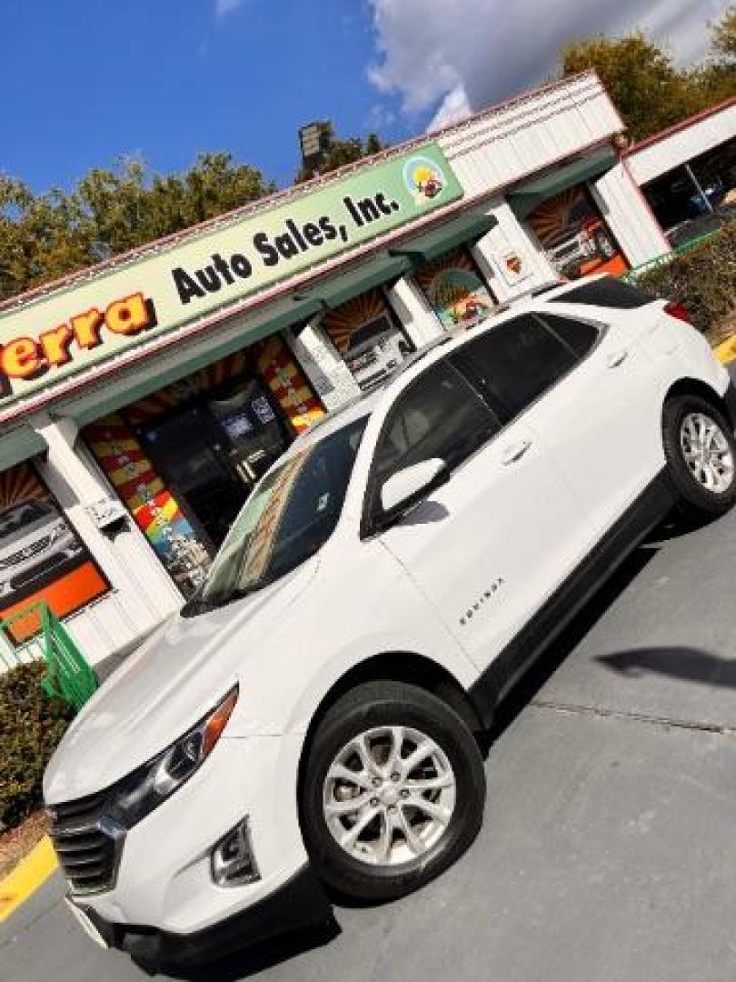2018 Summit White /Medium Ash Gray Chevrolet Equinox LT (2GNAXJEV9J6) with an 1.5L I-4 gasoline direct injection engine, located at 4545 Spencer Hwy., Pasadena, 77504, (832) 266-1645, 29.666037, -95.173775 - Photo#0
