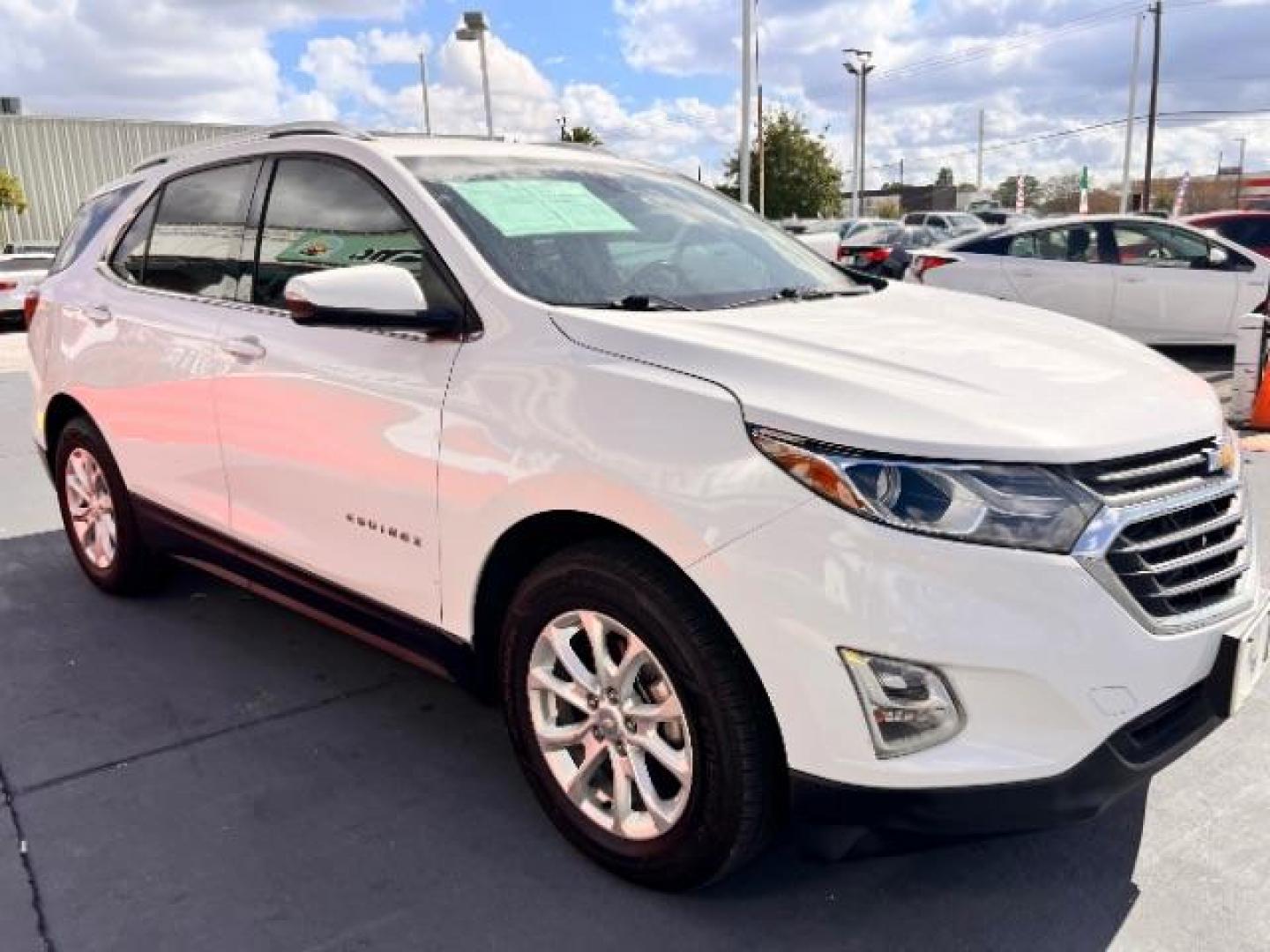 2018 Summit White /Medium Ash Gray Chevrolet Equinox LT (2GNAXJEV9J6) with an 1.5L I-4 gasoline direct injection engine, located at 4545 Spencer Hwy., Pasadena, 77504, (832) 266-1645, 29.666037, -95.173775 - Photo#2