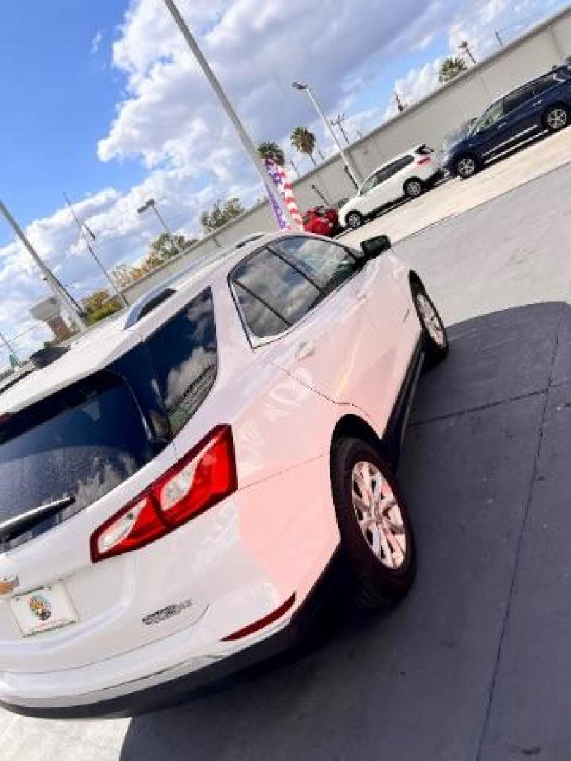 2018 Summit White /Medium Ash Gray Chevrolet Equinox LT (2GNAXJEV9J6) with an 1.5L I-4 gasoline direct injection engine, located at 4545 Spencer Hwy., Pasadena, 77504, (832) 266-1645, 29.666037, -95.173775 - Photo#4