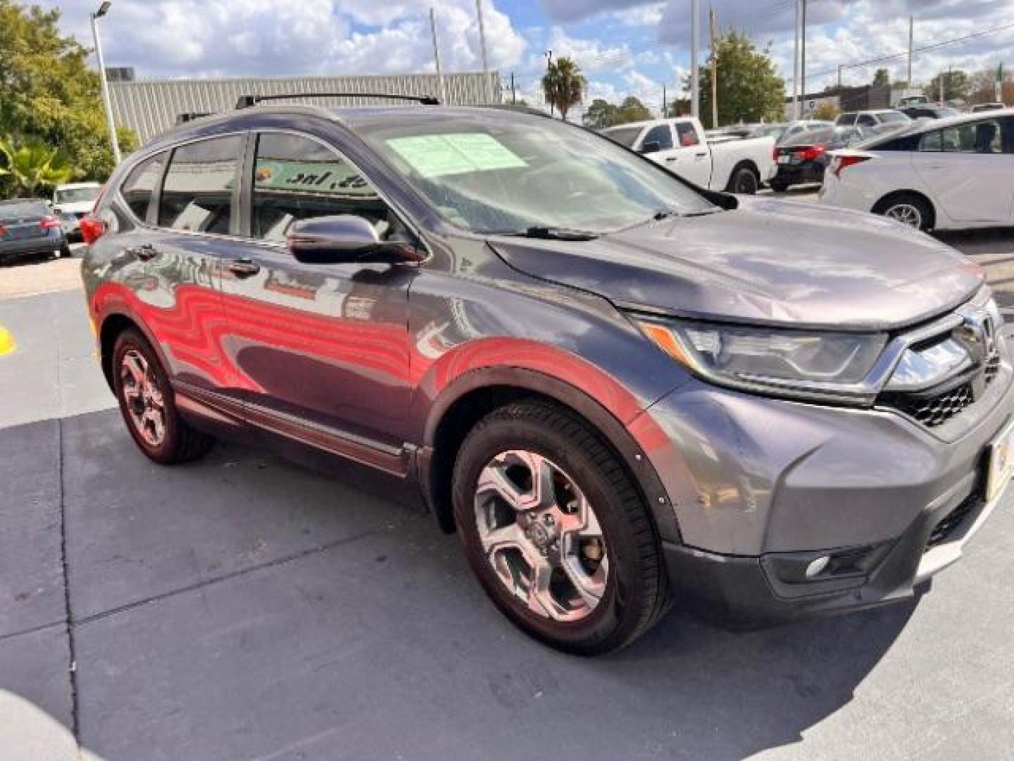 2017 Lunar Silver Metallic /Black Honda CR-V EX-L | EX-L Navi (7FARW1H86HE) with an 1.5L I-4 gasoline direct injection engine, located at 4545 Spencer Hwy., Pasadena, 77504, (832) 266-1645, 29.666037, -95.173775 - Photo#2