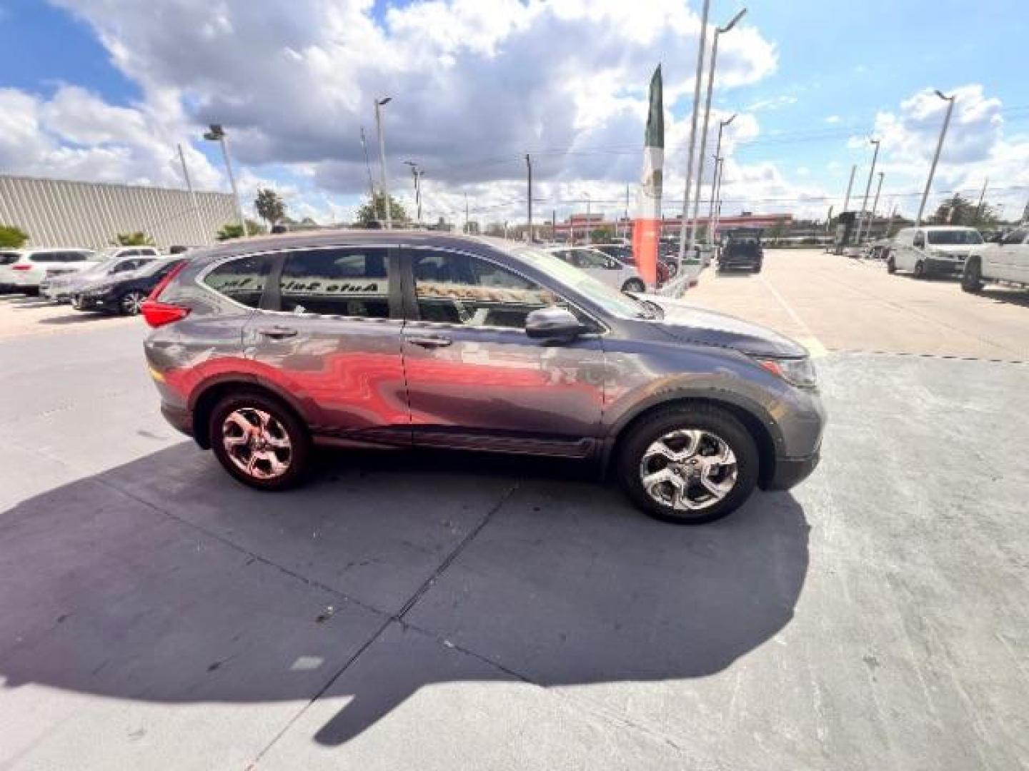2017 Lunar Silver Metallic /Black Honda CR-V EX-L | EX-L Navi (7FARW1H86HE) with an 1.5L I-4 gasoline direct injection engine, located at 4545 Spencer Hwy., Pasadena, 77504, (832) 266-1645, 29.666037, -95.173775 - Photo#3