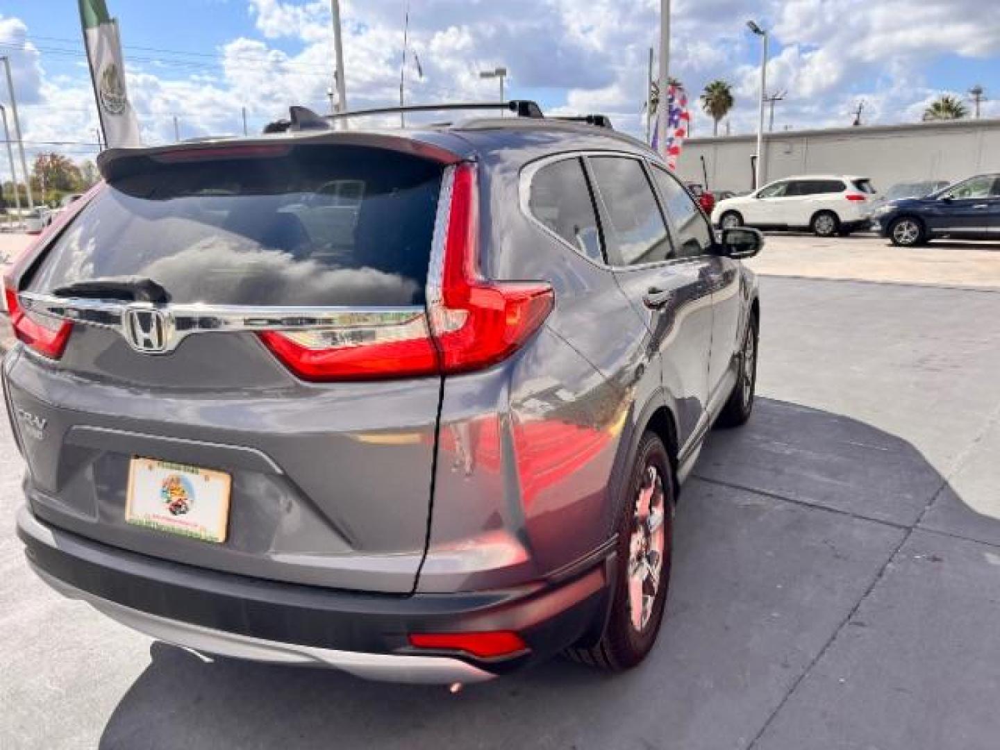 2017 Lunar Silver Metallic /Black Honda CR-V EX-L | EX-L Navi (7FARW1H86HE) with an 1.5L I-4 gasoline direct injection engine, located at 4545 Spencer Hwy., Pasadena, 77504, (832) 266-1645, 29.666037, -95.173775 - Photo#4