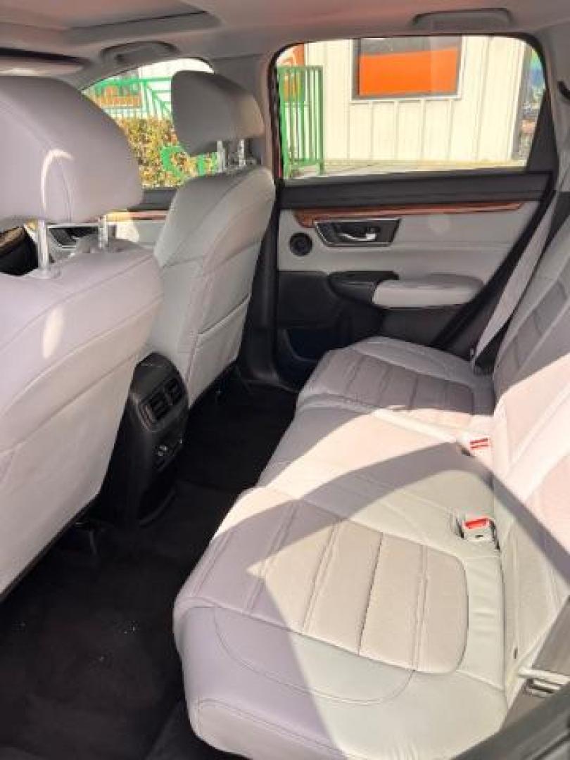 2017 Lunar Silver Metallic /Black Honda CR-V EX-L | EX-L Navi (7FARW1H86HE) with an 1.5L I-4 gasoline direct injection engine, located at 4545 Spencer Hwy., Pasadena, 77504, (832) 266-1645, 29.666037, -95.173775 - Photo#7