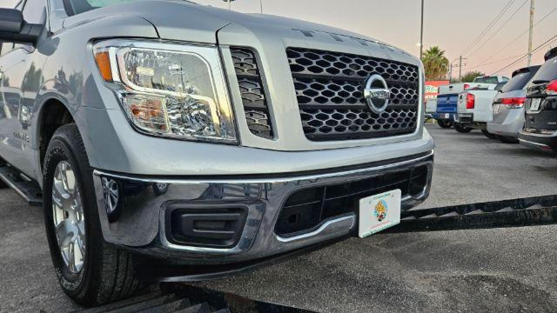 2019 Brilliant Silver Metallic /Black Nissan TITAN SV (1N6AA1EK2KN) with an Endurance 5.6L V-8 gasoline direct injection engine, located at 4545 Spencer Hwy., Pasadena, 77504, (832) 266-1645, 29.666037, -95.173775 - Photo#1