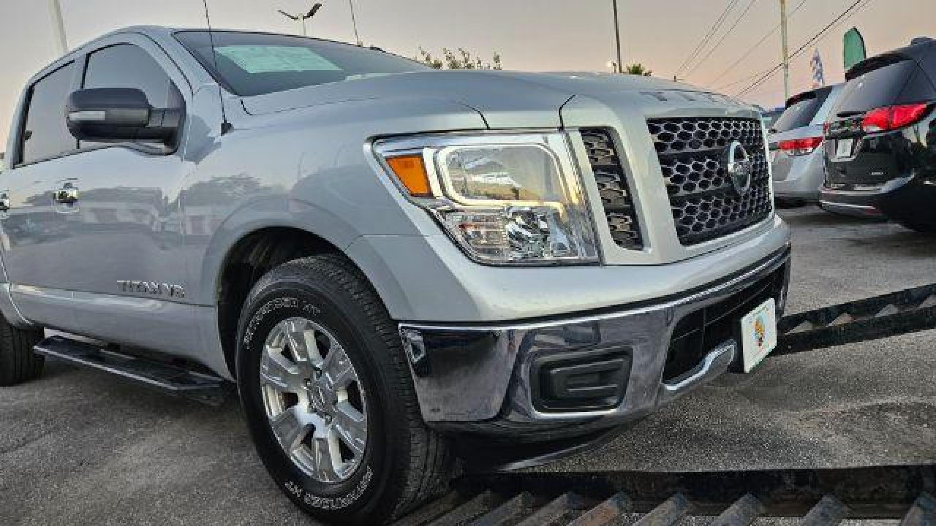 2019 Brilliant Silver Metallic /Black Nissan TITAN SV (1N6AA1EK2KN) with an Endurance 5.6L V-8 gasoline direct injection engine, located at 4545 Spencer Hwy., Pasadena, 77504, (832) 266-1645, 29.666037, -95.173775 - Photo#3