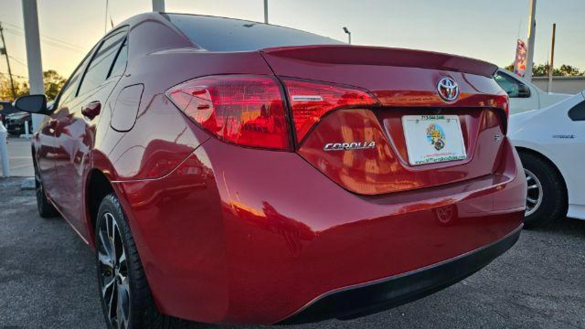 2017 Barcelona Red Metallic /Black Toyota Corolla SE (5YFBURHE4HP) with an 1.8L I-4 DOHC engine, located at 4545 Spencer Hwy., Pasadena, 77504, (832) 266-1645, 29.666037, -95.173775 - Photo#2