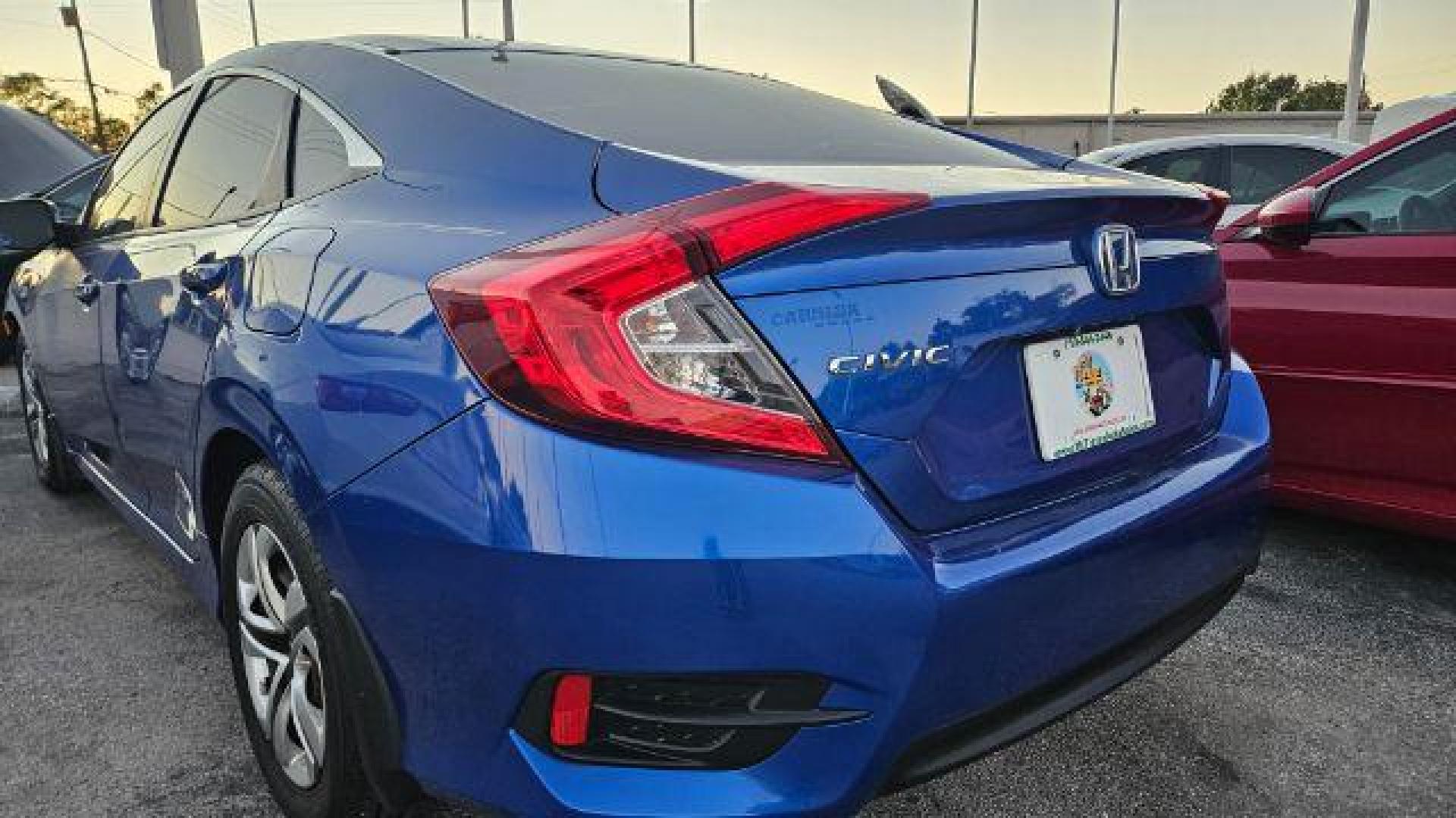2017 Cosmic Blue Metallic /Ivory Honda Civic LX (19XFC2F51HE) with an 2L I-4 DOHC engine, located at 4545 Spencer Hwy., Pasadena, 77504, (832) 266-1645, 29.666037, -95.173775 - Photo#10