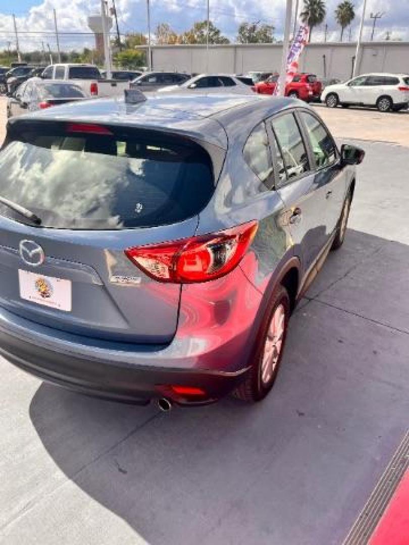 2014 Deep Crystal Blue Mica /Black Mazda CX-5 Sport (JM3KE2BE6E0) with an SKYACTIV-G 2L I-4 gasoline direct injection engine, located at 4545 Spencer Hwy., Pasadena, 77504, (832) 266-1645, 29.666037, -95.173775 - Photo#4