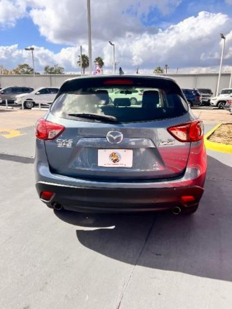 2014 Deep Crystal Blue Mica /Black Mazda CX-5 Sport (JM3KE2BE6E0) with an SKYACTIV-G 2L I-4 gasoline direct injection engine, located at 4545 Spencer Hwy., Pasadena, 77504, (832) 266-1645, 29.666037, -95.173775 - Photo#5