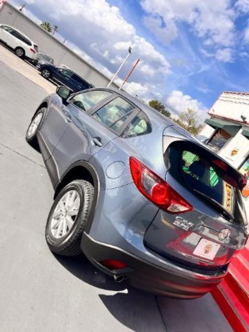 2014 Deep Crystal Blue Mica /Black Mazda CX-5 Sport (JM3KE2BE6E0) with an SKYACTIV-G 2L I-4 gasoline direct injection engine, located at 4545 Spencer Hwy., Pasadena, 77504, (832) 266-1645, 29.666037, -95.173775 - Photo#6