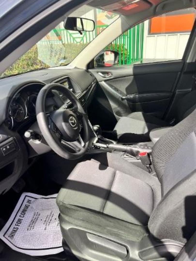2014 Deep Crystal Blue Mica /Black Mazda CX-5 Sport (JM3KE2BE6E0) with an SKYACTIV-G 2L I-4 gasoline direct injection engine, located at 4545 Spencer Hwy., Pasadena, 77504, (832) 266-1645, 29.666037, -95.173775 - Photo#9