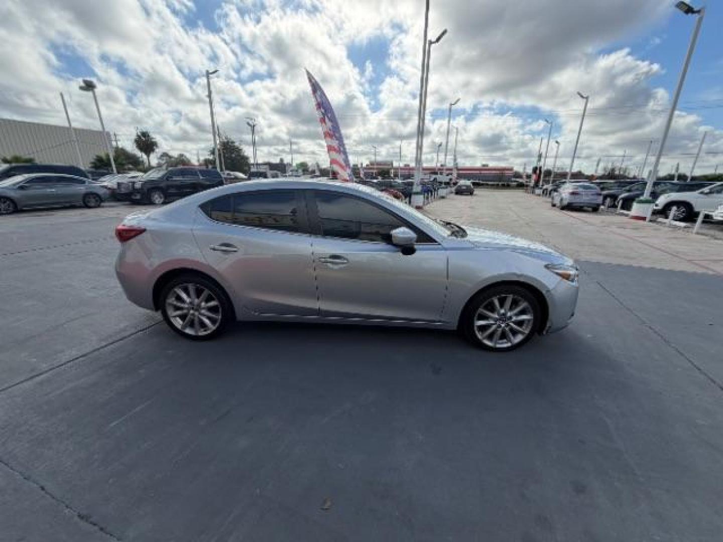 2017 Sonic Silver Metallic /Black Mazda Mazda3 Grand Touring (JM1BN1W32H1) with an SKYACTIV-G 2.5L I-4 gasoline direct injection engine, located at 4545 Spencer Hwy., Pasadena, 77504, (832) 266-1645, 29.666037, -95.173775 - Photo#3