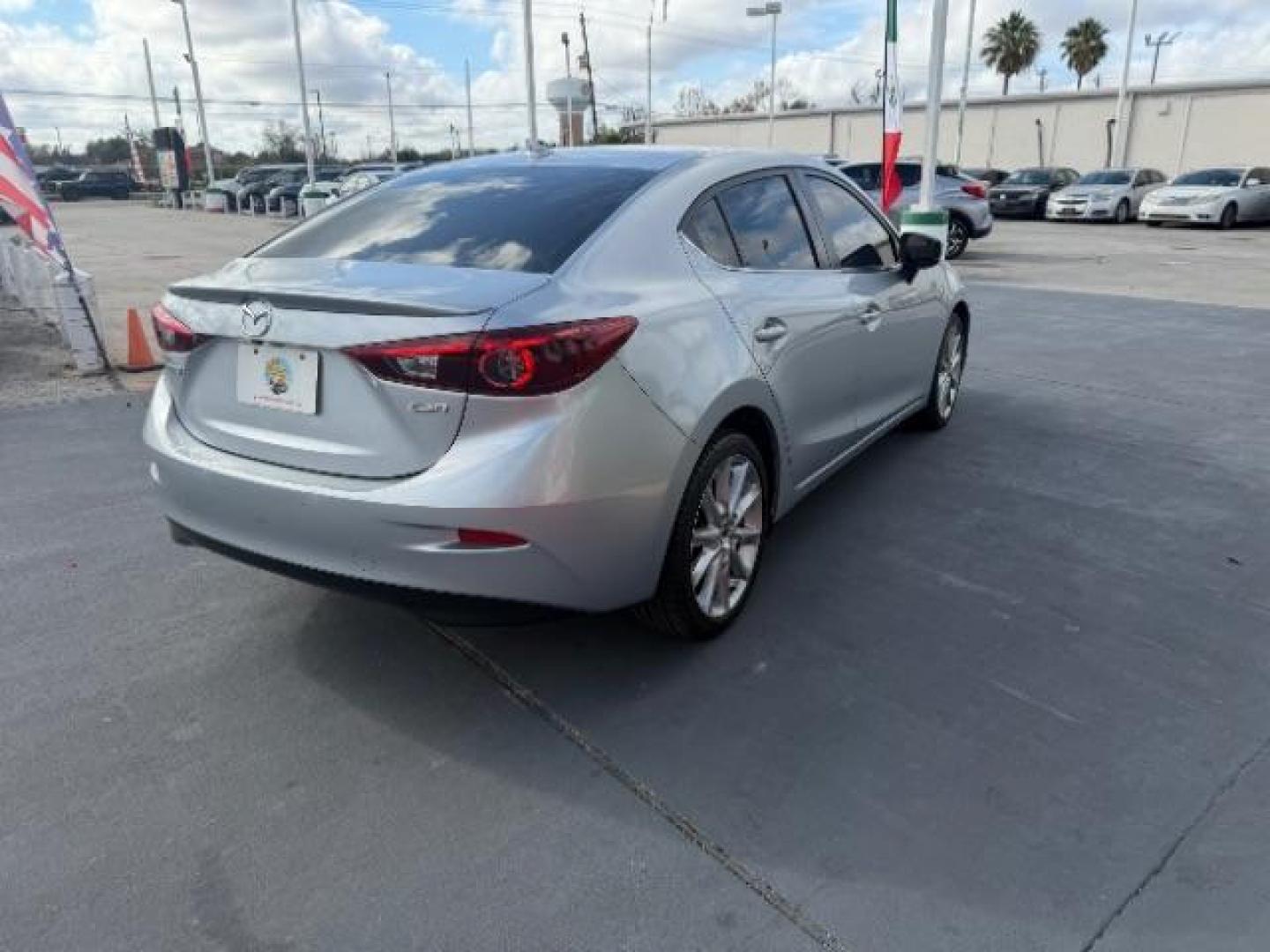 2017 Sonic Silver Metallic /Black Mazda Mazda3 Grand Touring (JM1BN1W32H1) with an SKYACTIV-G 2.5L I-4 gasoline direct injection engine, located at 4545 Spencer Hwy., Pasadena, 77504, (832) 266-1645, 29.666037, -95.173775 - Photo#4