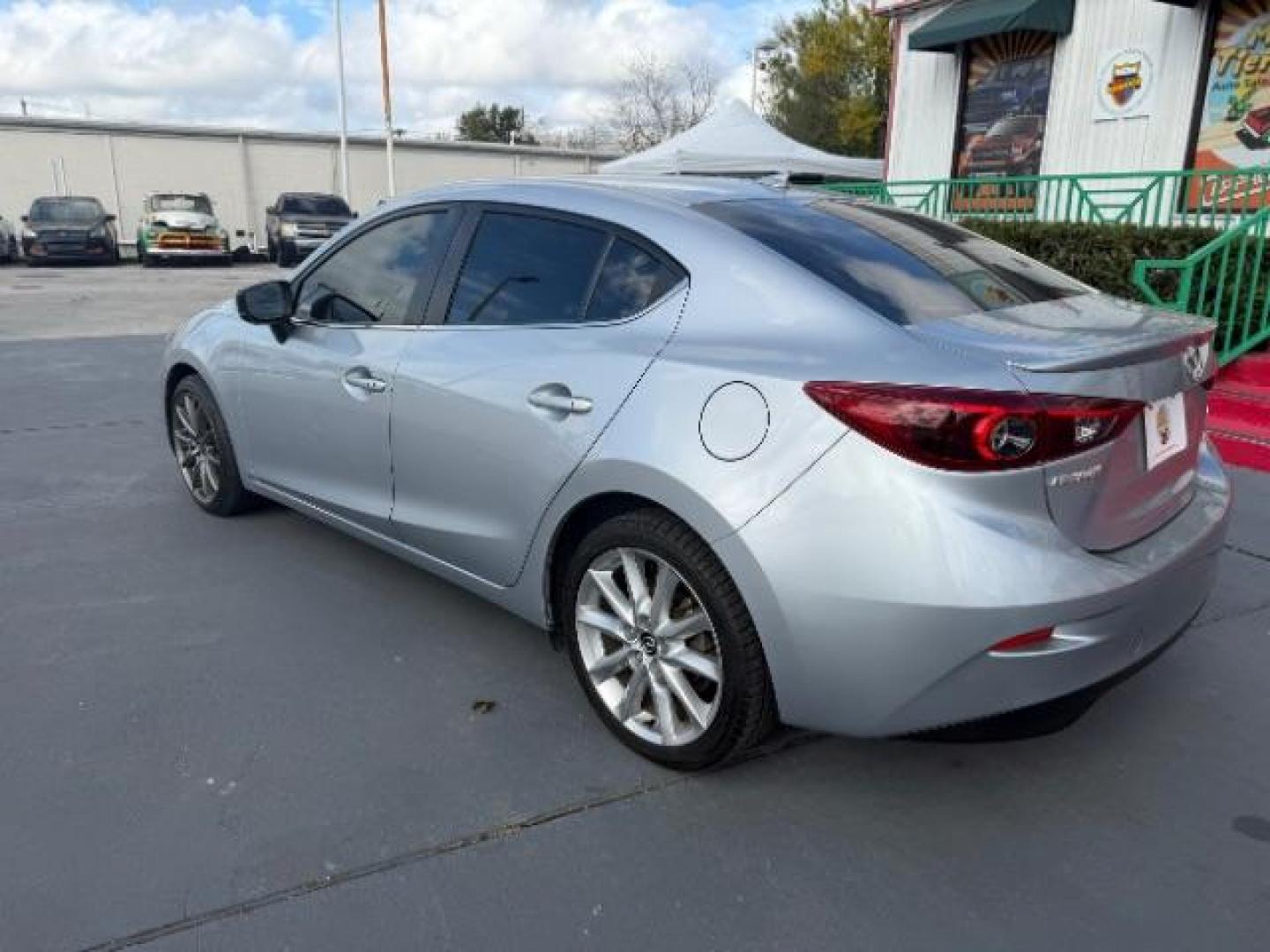 2017 Sonic Silver Metallic /Black Mazda Mazda3 Grand Touring (JM1BN1W32H1) with an SKYACTIV-G 2.5L I-4 gasoline direct injection engine, located at 4545 Spencer Hwy., Pasadena, 77504, (832) 266-1645, 29.666037, -95.173775 - Photo#5