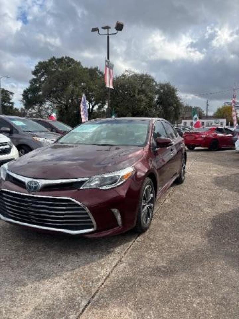 2018 Ooh La La Rouge Mica Toyota Avalon Hybrid XLE Premium (4T1BD1EB6JU) with an 2.5L I-4 DOHC engine, located at 7935 Gulf Freeway, Houston, 77017, (832) 266-1645, 29.684393, -95.275665 - Photo#2