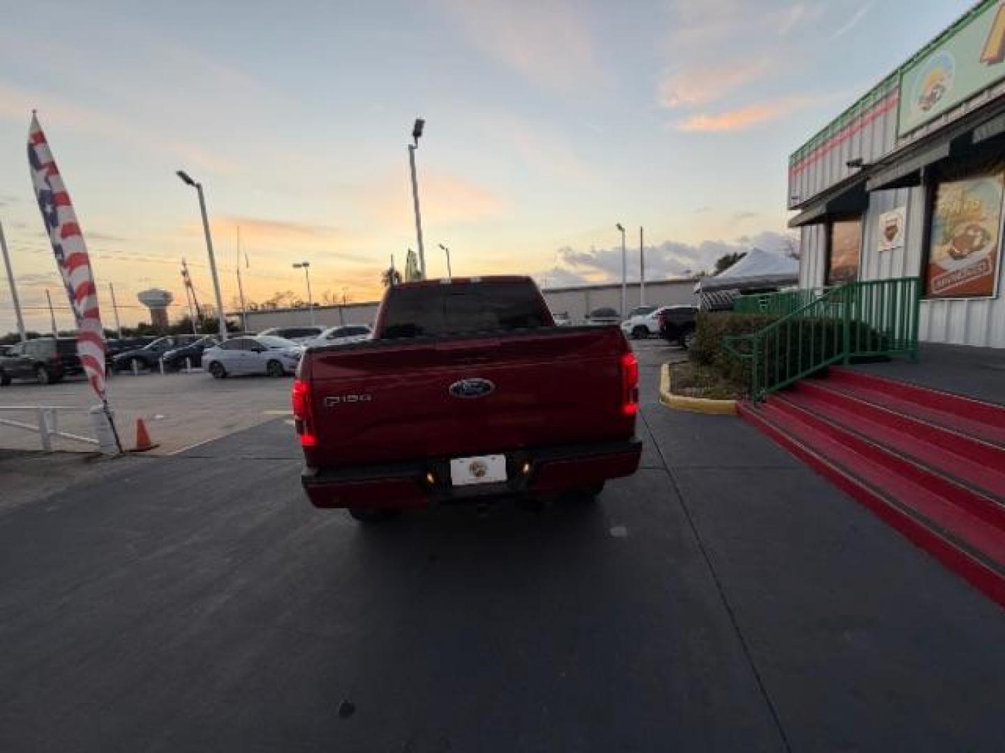 2015 Ruby Red Metallic Tinted Clearcoat /Black Ford F-150 LARIAT (1FTEW1EG5FF) , located at 4545 Spencer Hwy., Pasadena, 77504, (832) 266-1645, 29.666037, -95.173775 - Photo#4