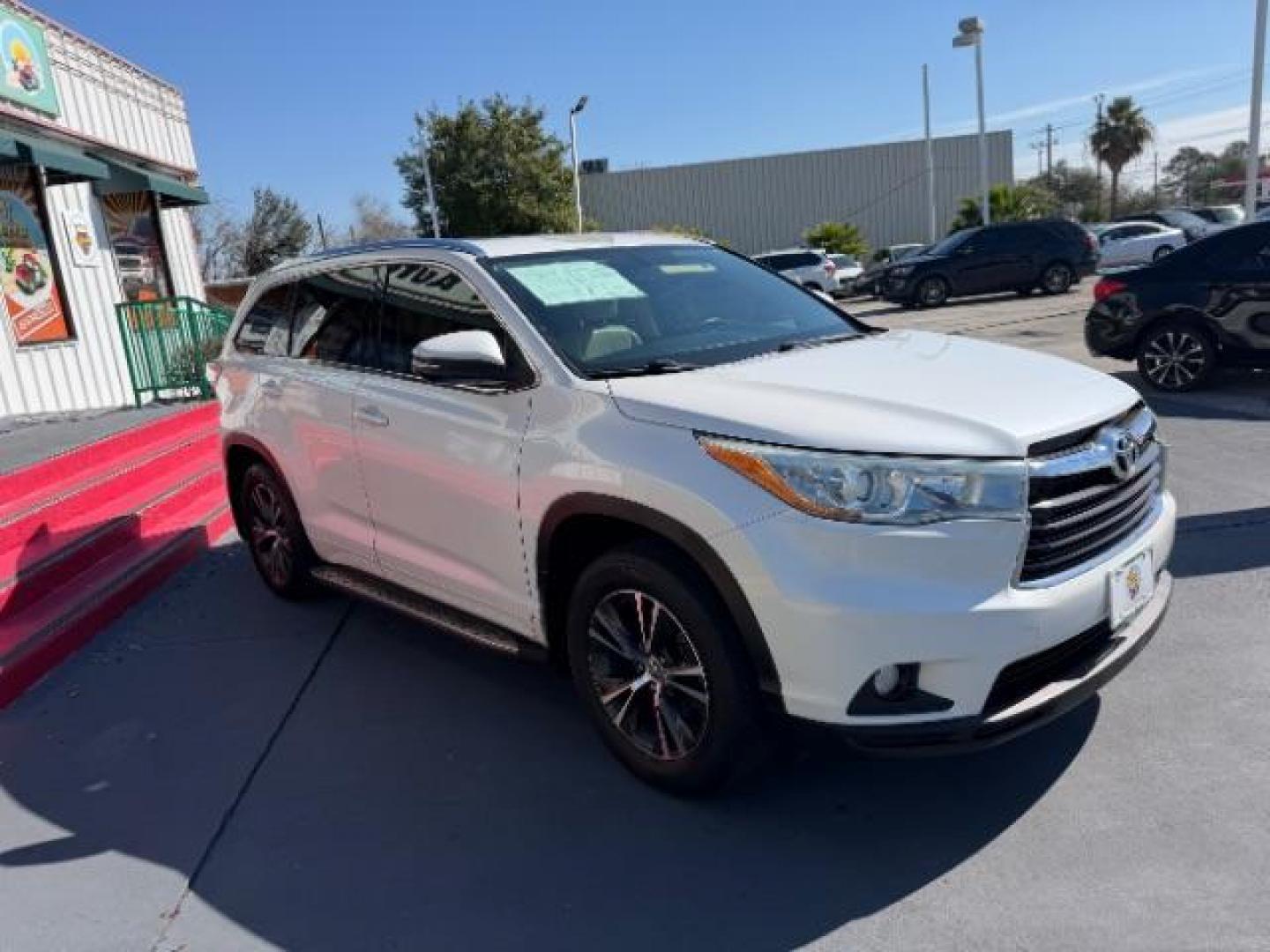 2016 Blizzard Pearl /Almond Toyota Highlander XLE V6 (5TDKKRFHXGS) with an 3.5L V-6 DOHC engine, located at 4545 Spencer Hwy., Pasadena, 77504, (832) 266-1645, 29.666037, -95.173775 - Photo#2