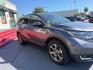 2019 Dark Olive Metallic /Gray Honda CR-V EX (5J6RW2H58KL) with an 1.5L I-4 gasoline direct injection engine, located at 4545 Spencer Hwy., Pasadena, 77504, (832) 266-1645, 29.666037, -95.173775 - Photo#2