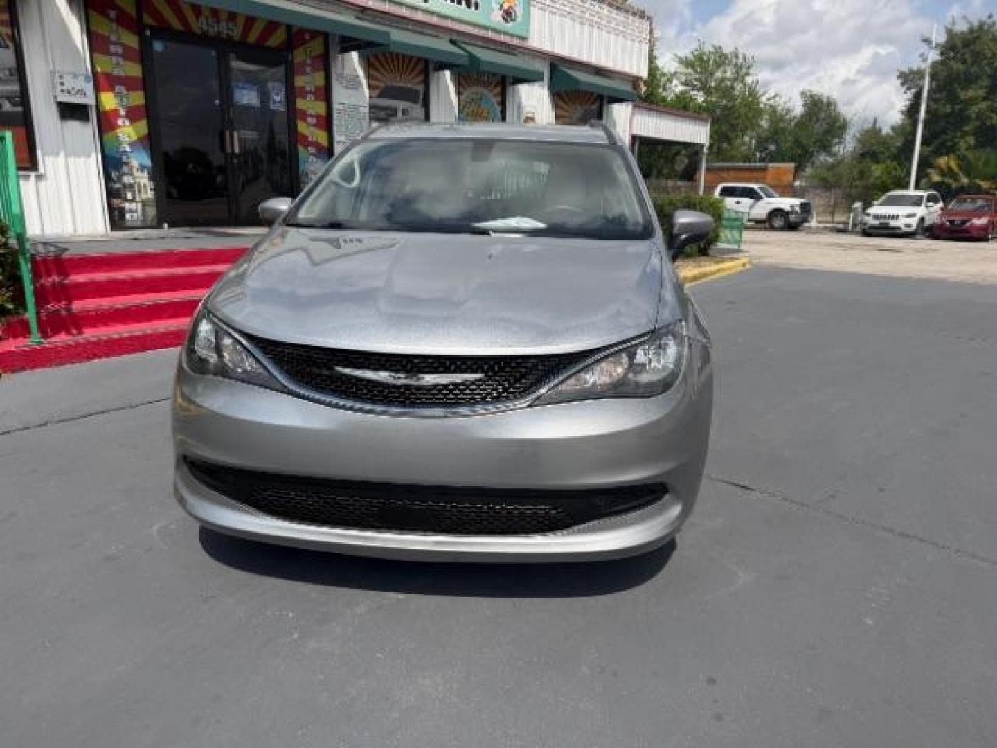 2021 Billet Silver Metallic Clearcoat /Cognac/Alloy/Alloy Chrysler Voyager LXI (2C4RC1DG0MR) with an 3.6L V-6 DOHC engine, located at 4545 Spencer Hwy., Pasadena, 77504, (832) 266-1645, 29.666037, -95.173775 - Photo#1