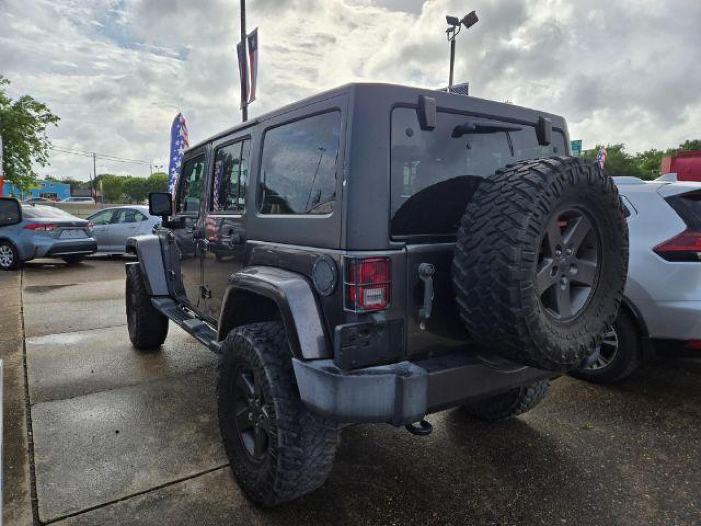 2016 Granite Crystal Metallic Clearcoat Jeep Wrangler Unlimited Freedom (1C4BJWDG6GL) with an Pentastar 3.6L V-6 DOHC engine, located at 7935 Gulf Freeway, Houston, 77017, (832) 266-1645, 29.684393, -95.275665 - Photo#2