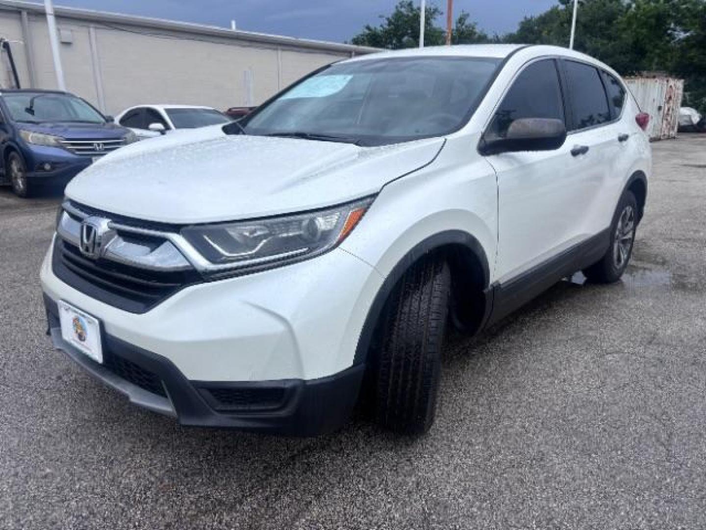 2018 White Diamond Pearl Honda CR-V LX (5J6RW5H30JL) with an 2.4L I-4 gasoline direct injection engine, located at 4545 Spencer Hwy., Pasadena, 77504, (832) 266-1645, 29.666037, -95.173775 - Photo#3