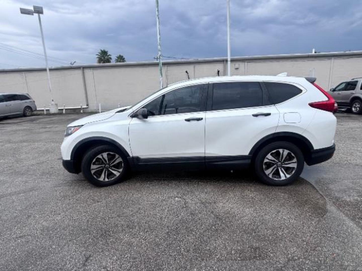 2018 White Diamond Pearl Honda CR-V LX (5J6RW5H30JL) with an 2.4L I-4 gasoline direct injection engine, located at 4545 Spencer Hwy., Pasadena, 77504, (832) 266-1645, 29.666037, -95.173775 - Photo#4