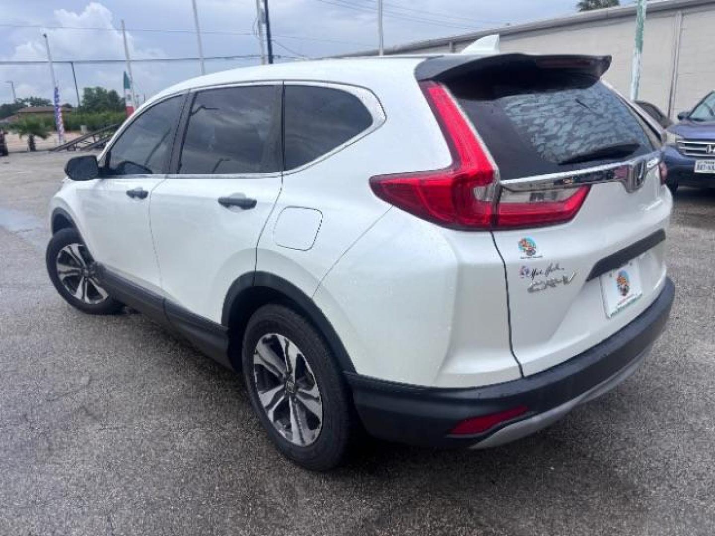 2018 White Diamond Pearl Honda CR-V LX (5J6RW5H30JL) with an 2.4L I-4 gasoline direct injection engine, located at 4545 Spencer Hwy., Pasadena, 77504, (832) 266-1645, 29.666037, -95.173775 - Photo#5