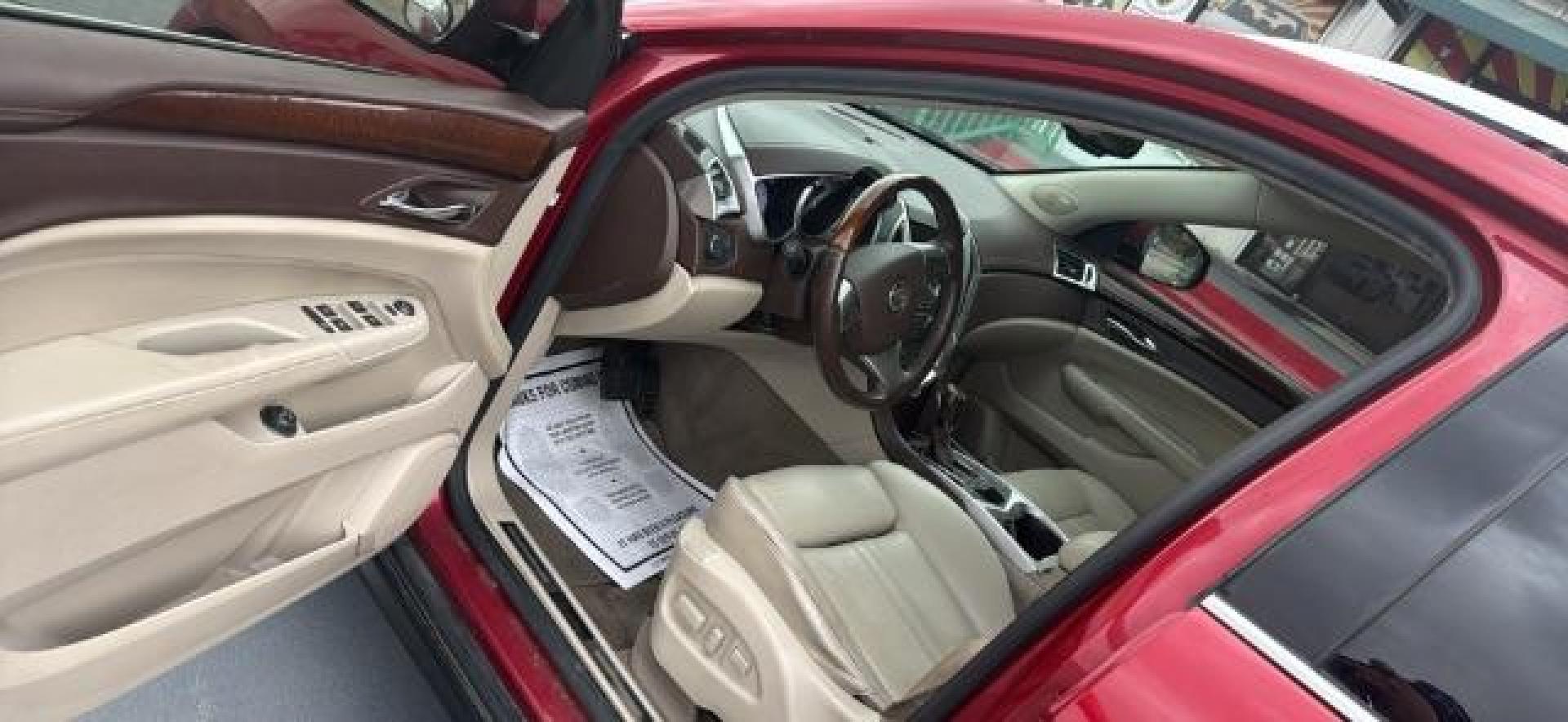 2011 Crystal Red Tintcoat /Shale/Ebony Leather Cadillac SRX Luxury Collection (3GYFNAEY5BS) with an 3.0L V6 DOHC 24V engine, 6-Speed Automatic transmission, located at 4545 Spencer Hwy., Pasadena, 77504, (832) 266-1645, 29.666037, -95.173775 - Photo#3