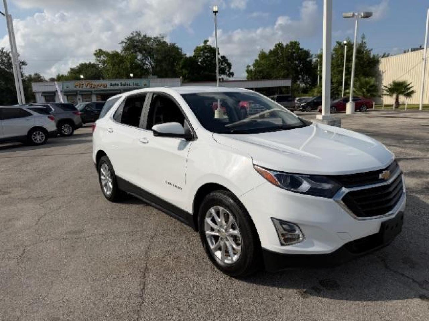 2021 Summit White /Jet Black Chevrolet Equinox FWD LT (2GNAXKEV5M6) with an 1.5L I-4 gasoline direct injection engine, located at 4545 Spencer Hwy., Pasadena, 77504, (832) 266-1645, 29.666037, -95.173775 - Photo#0