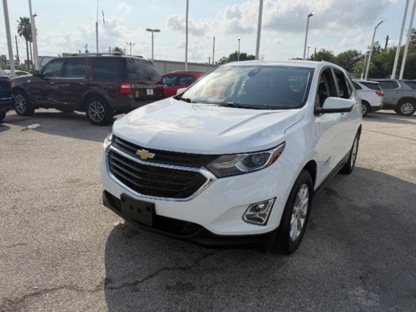 2021 Summit White /Jet Black Chevrolet Equinox FWD LT (2GNAXKEV5M6) with an 1.5L I-4 gasoline direct injection engine, located at 4545 Spencer Hwy., Pasadena, 77504, (832) 266-1645, 29.666037, -95.173775 - Photo#1
