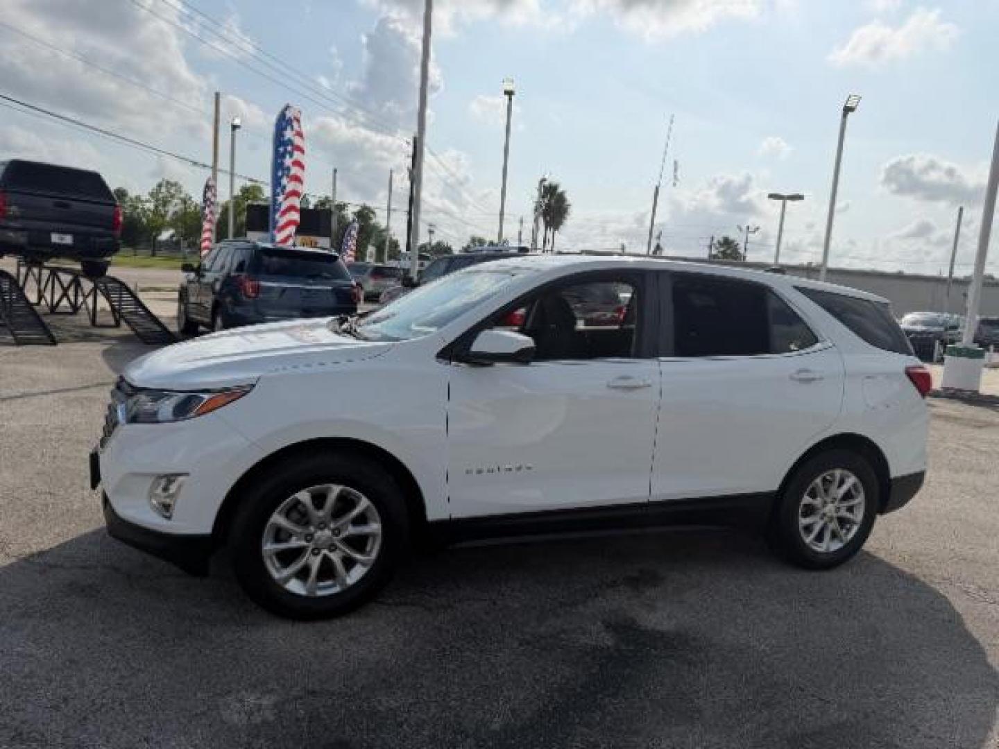 2021 Summit White /Jet Black Chevrolet Equinox FWD LT (2GNAXKEV5M6) with an 1.5L I-4 gasoline direct injection engine, located at 4545 Spencer Hwy., Pasadena, 77504, (832) 266-1645, 29.666037, -95.173775 - Photo#2