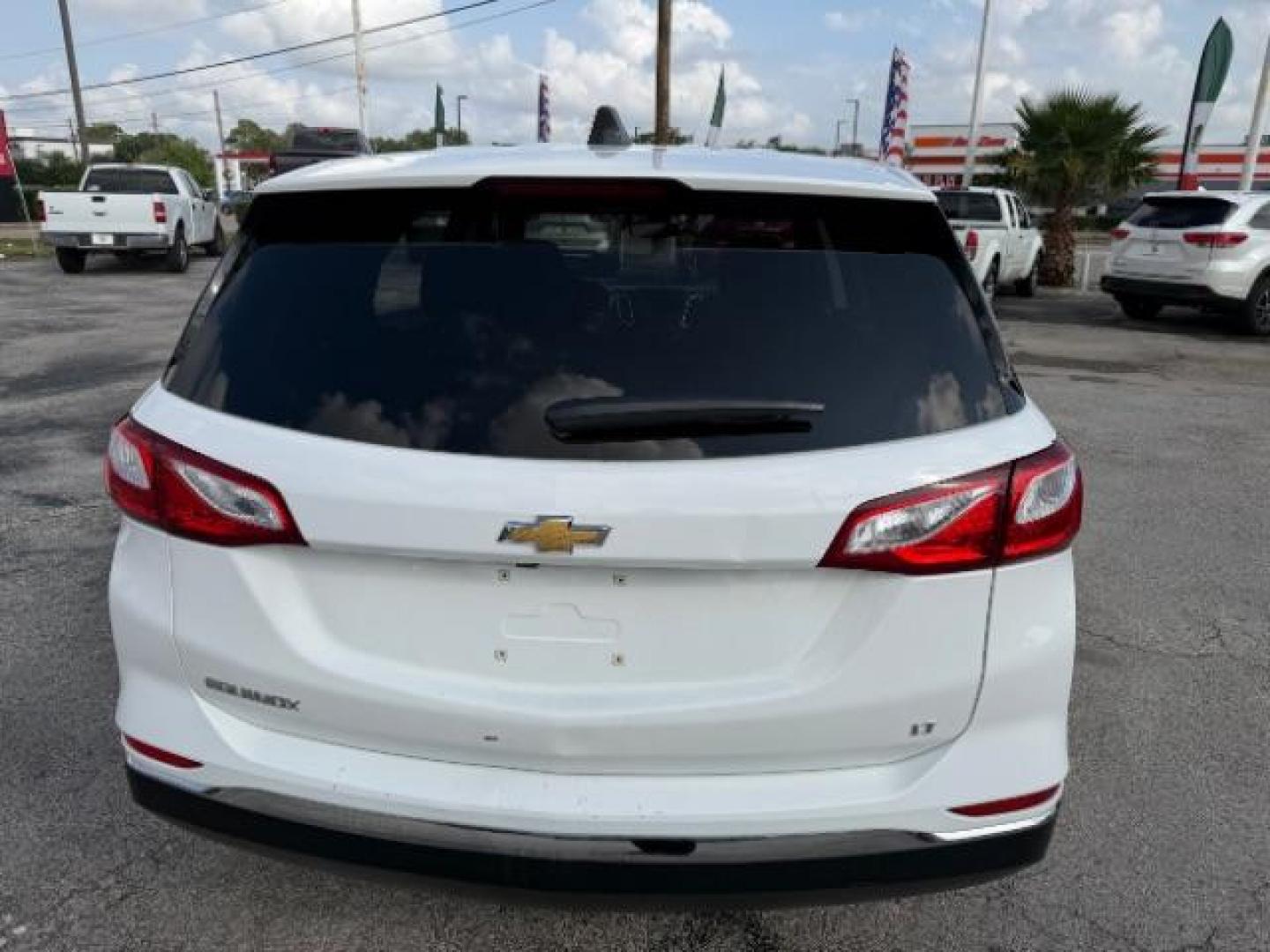 2021 Summit White /Jet Black Chevrolet Equinox FWD LT (2GNAXKEV5M6) with an 1.5L I-4 gasoline direct injection engine, located at 4545 Spencer Hwy., Pasadena, 77504, (832) 266-1645, 29.666037, -95.173775 - Photo#3