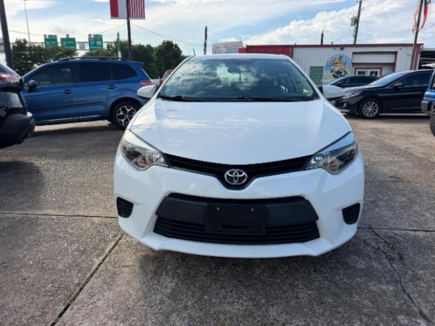 2014 Super White Toyota Corolla LE (5YFBURHE5EP) with an 1.8L I-4 DOHC engine, located at 7935 Gulf Freeway, Houston, 77017, (832) 266-1645, 29.684393, -95.275665- Photo#1