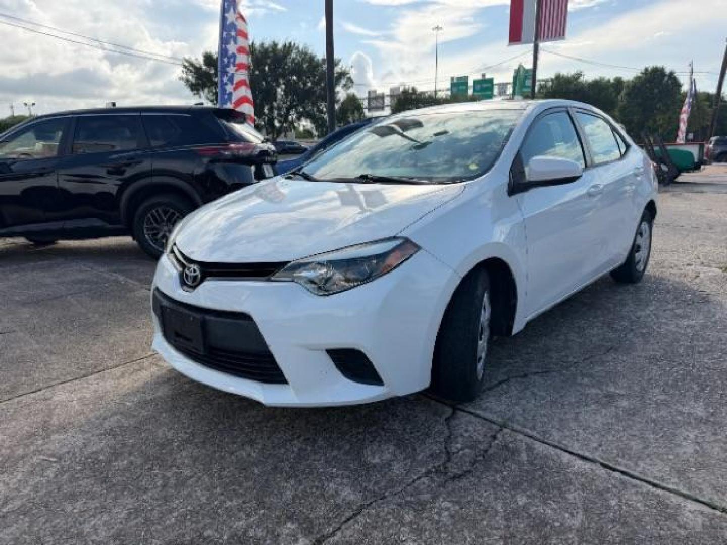 2014 Super White Toyota Corolla LE (5YFBURHE5EP) with an 1.8L I-4 DOHC engine, located at 7935 Gulf Freeway, Houston, 77017, (832) 266-1645, 29.684393, -95.275665- Photo#2