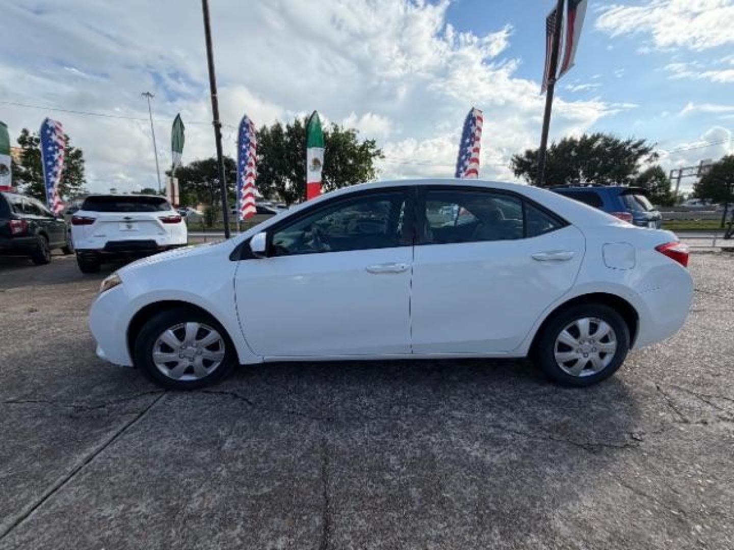 2014 Super White Toyota Corolla LE (5YFBURHE5EP) with an 1.8L I-4 DOHC engine, located at 7935 Gulf Freeway, Houston, 77017, (832) 266-1645, 29.684393, -95.275665- Photo#3
