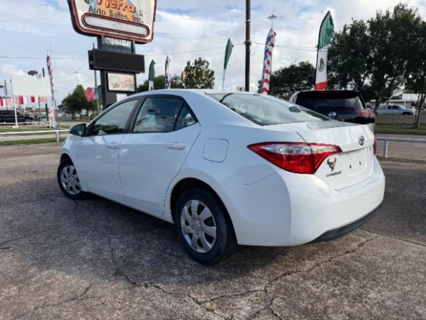 2014 Super White Toyota Corolla LE (5YFBURHE5EP) with an 1.8L I-4 DOHC engine, located at 7935 Gulf Freeway, Houston, 77017, (832) 266-1645, 29.684393, -95.275665- Photo#4