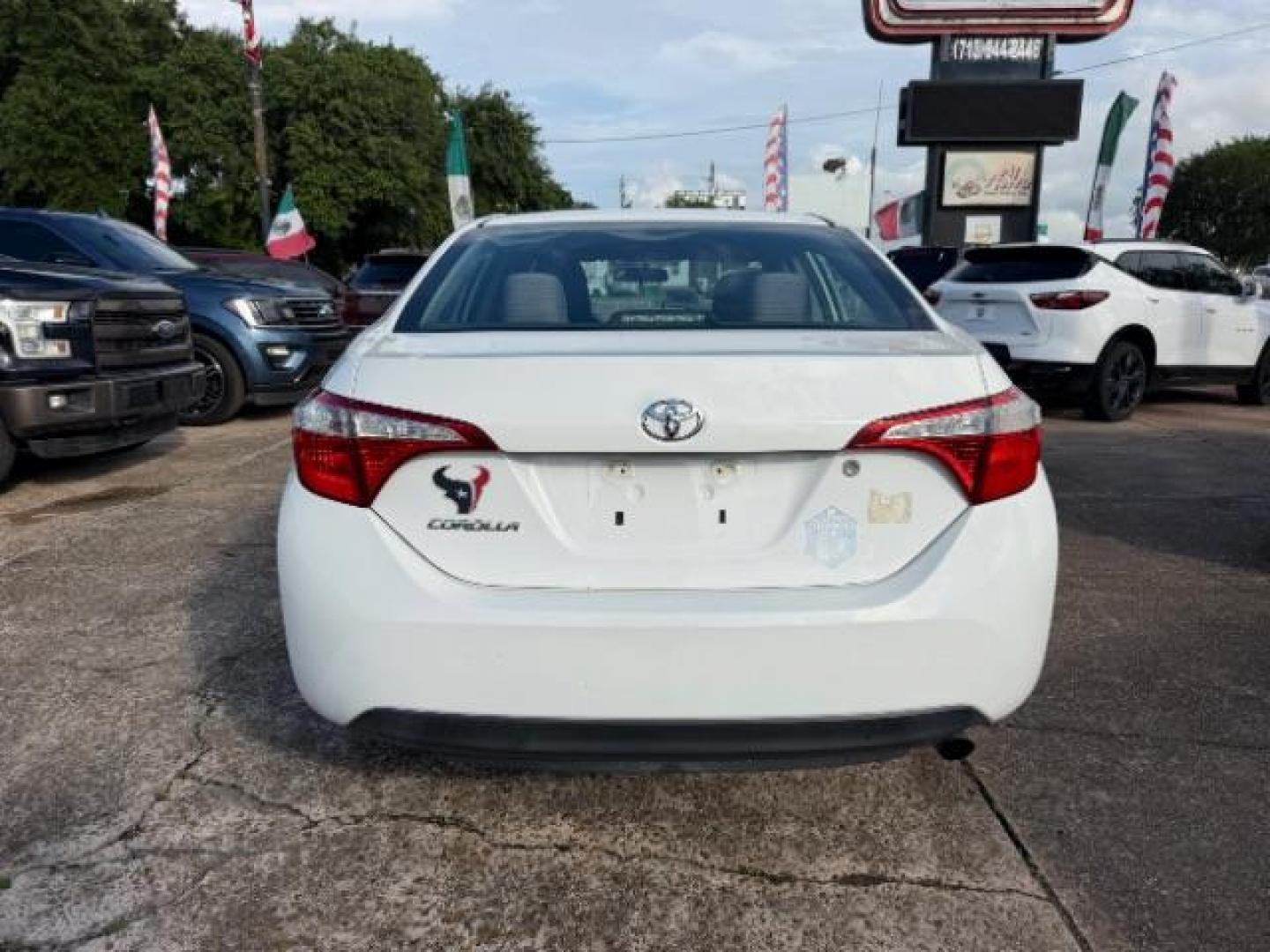 2014 Super White Toyota Corolla LE (5YFBURHE5EP) with an 1.8L I-4 DOHC engine, located at 7935 Gulf Freeway, Houston, 77017, (832) 266-1645, 29.684393, -95.275665- Photo#5