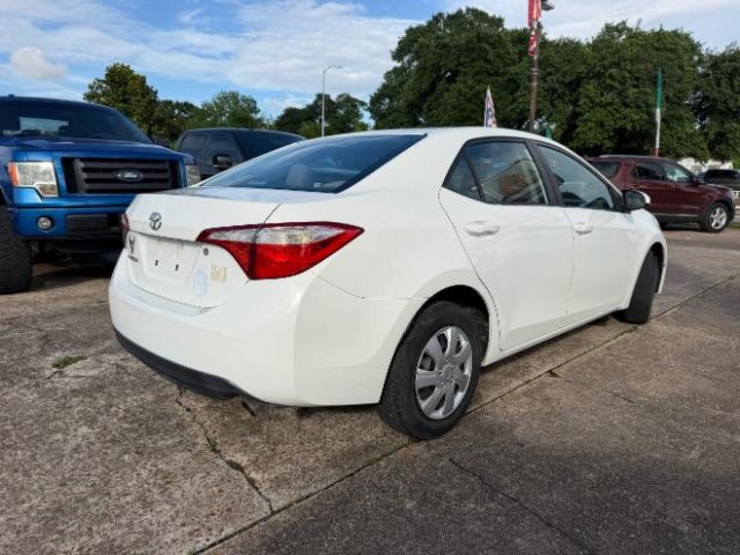 2014 Super White Toyota Corolla LE (5YFBURHE5EP) with an 1.8L I-4 DOHC engine, located at 7935 Gulf Freeway, Houston, 77017, (832) 266-1645, 29.684393, -95.275665- Photo#6
