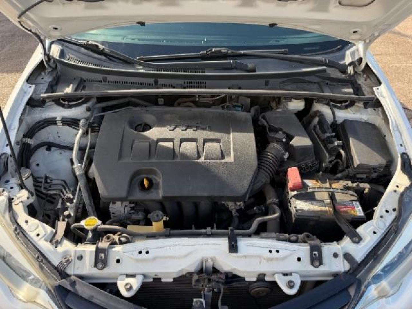 2014 Super White Toyota Corolla LE (5YFBURHE5EP) with an 1.8L I-4 DOHC engine, located at 7935 Gulf Freeway, Houston, 77017, (832) 266-1645, 29.684393, -95.275665- Photo#13