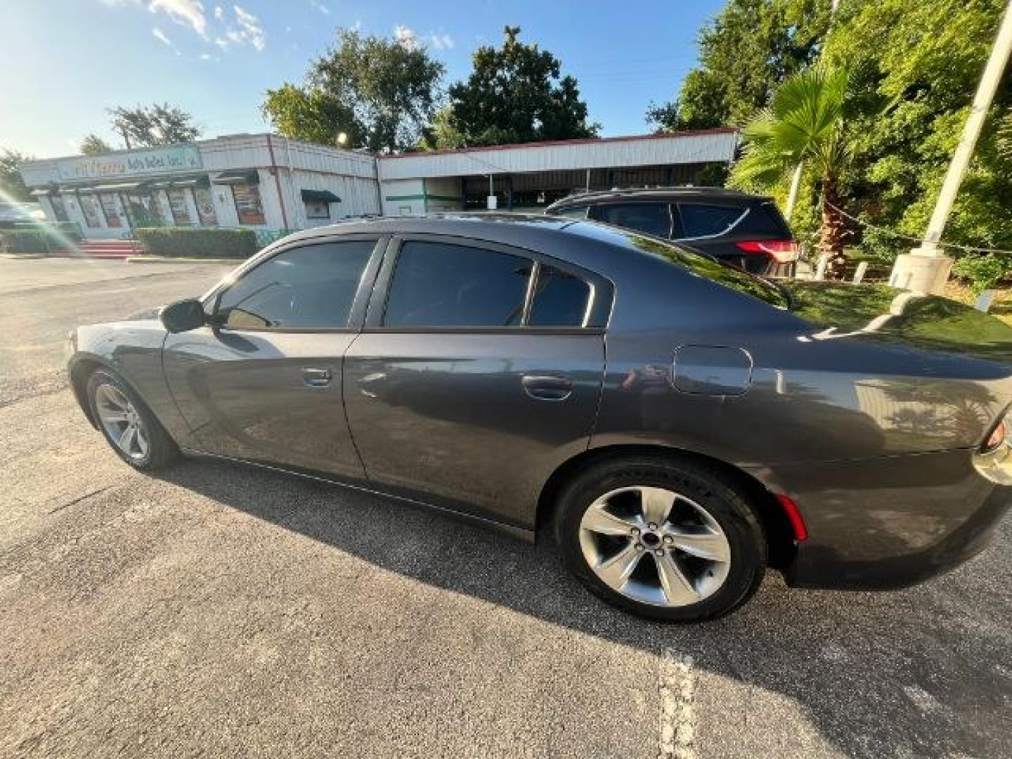 2015 Granite Crystal Meta /Black Dodge Charger SE (2C3CDXBGXFH) with an 3.6L V-6 DOHC engine, located at 4545 Spencer Hwy., Pasadena, 77504, (832) 266-1645, 29.666037, -95.173775- Photo#2